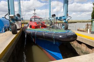 A Goodchild Marine boat docked in the water.