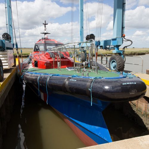 A Goodchild Marine boat docked in the water.