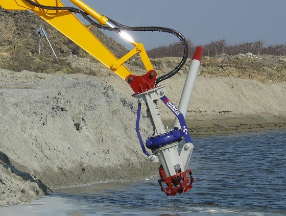 A Goodchild Marine excavator is being used to dig a hole in the water.