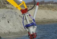 A blue and yellow Goodchild Marine excavator.