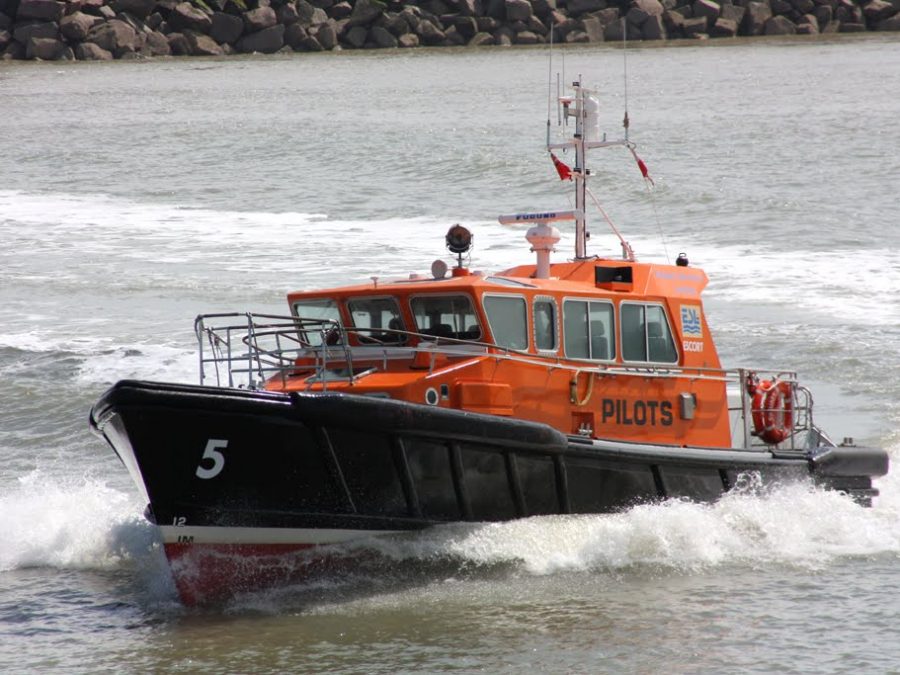 A Goodchild Marine boat is traveling in the water.