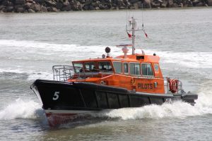 A Goodchild Marine boat is traveling in the water.