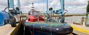 A Goodchild Marine boat docked at a dock.
