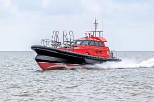 A Goodchild Marine boat gracefully glides through the water.