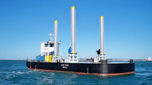 A Goodchild Marine boat with a large number of poles in the water.