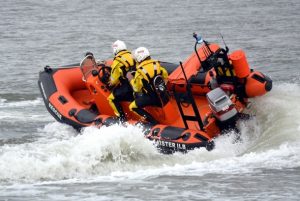 A group of people riding in a Goodchild Marine boat on the water.