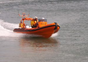 A Goodchild Marine lifeboat is speeding down the water with remarkable efficacy.