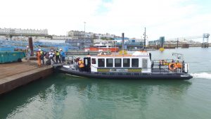 A Goodchild Marine boat docked at a dock.