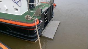 A Goodchild Marine boat docked in the water with a rope attached to it.