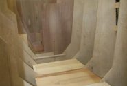 A wooden staircase in the Goodchild Marine factory.