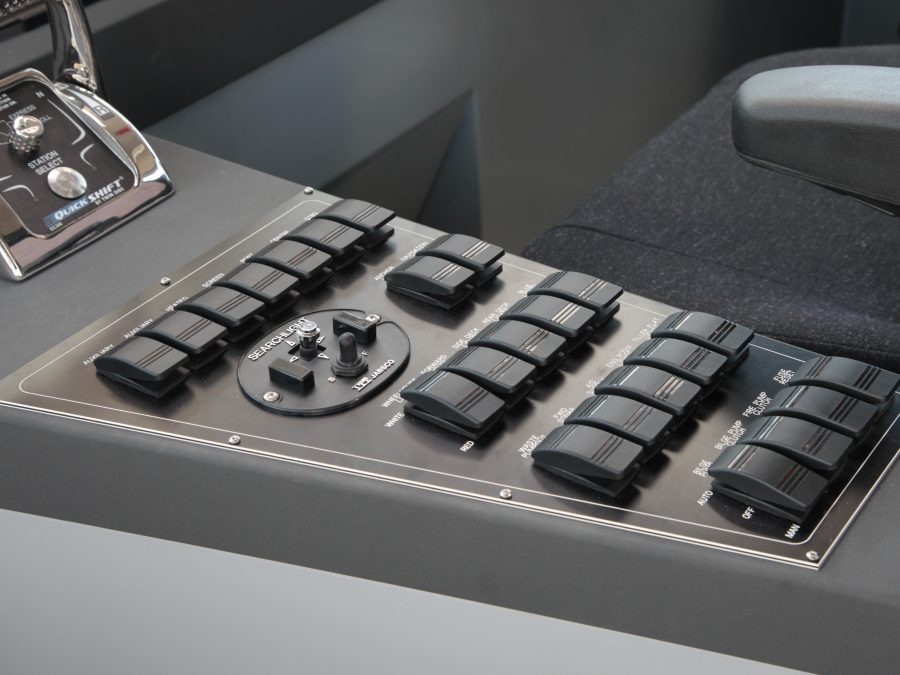 The Goodchild Marine control panel of a boat with a lot of buttons.
