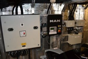 A room filled with a plethora of electrical equipment in it, including some by Goodchild Marine.