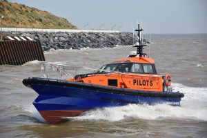 A Goodchild Marine boat gracefully glides through the water.